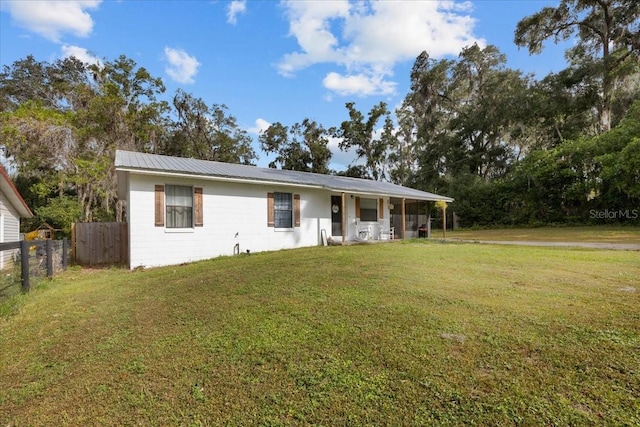 ranch-style home with a front yard