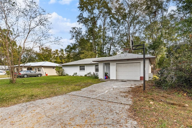 ranch-style house with a front yard and a garage