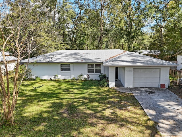 ranch-style home with a garage and a front yard