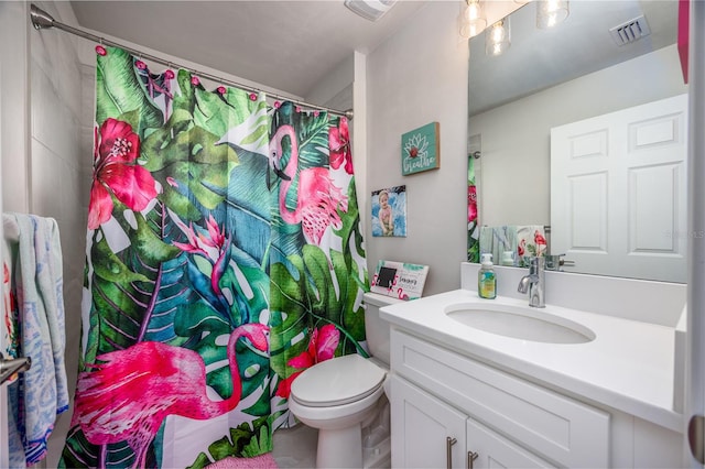 bathroom with vanity, toilet, and a shower with curtain