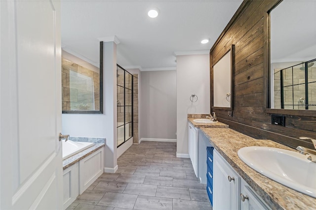 bathroom featuring crown molding, vanity, and shower with separate bathtub