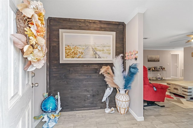 details with wooden walls and ceiling fan