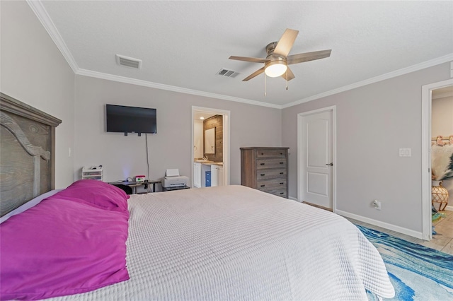 tiled bedroom featuring ceiling fan, crown molding, and ensuite bathroom