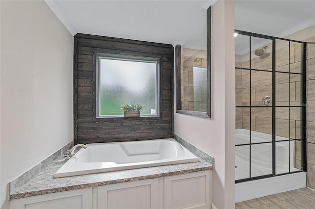 bathroom featuring hardwood / wood-style flooring, separate shower and tub, and crown molding