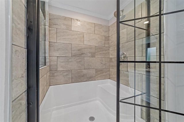 bathroom featuring ornamental molding and separate shower and tub