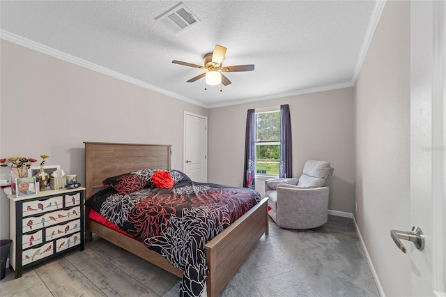 bedroom with a textured ceiling, ceiling fan, and crown molding