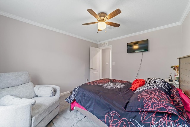 bedroom with ceiling fan and crown molding