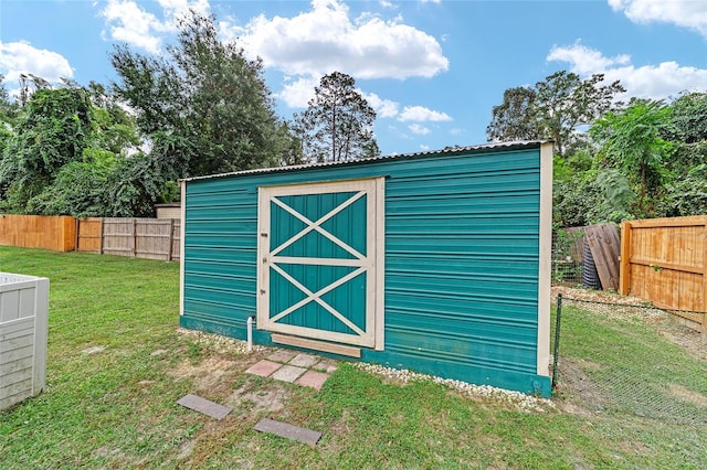 view of outdoor structure with a yard