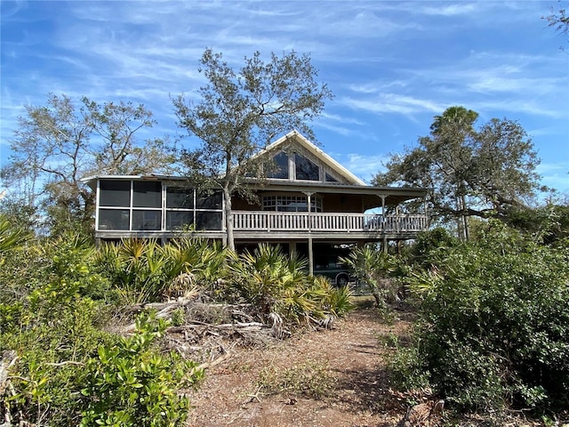 back of house with a sunroom