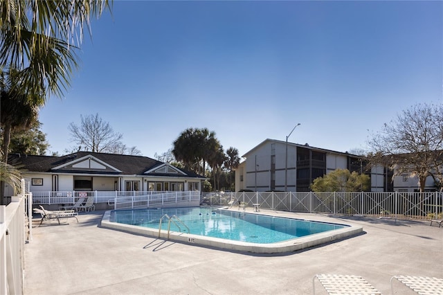 view of swimming pool with a patio area