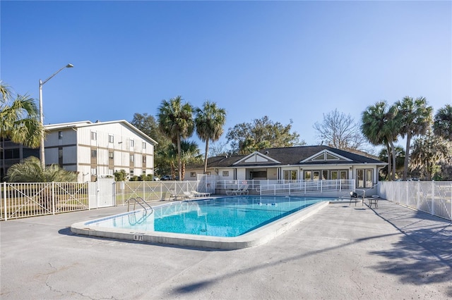 view of swimming pool featuring a patio area