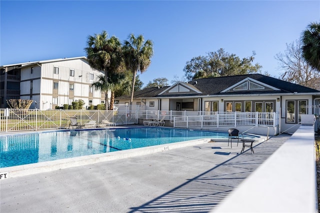 view of swimming pool with a patio