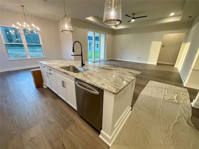 kitchen featuring sink, stainless steel dishwasher, white cabinets, dark hardwood / wood-style floors, and a kitchen island with sink