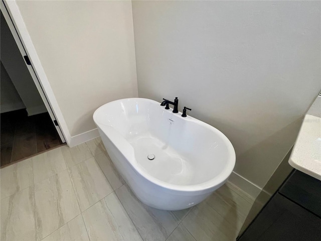840 SW 144th Dr, Newberry, FL 32669 - full bathroom with a freestanding bath and baseboards