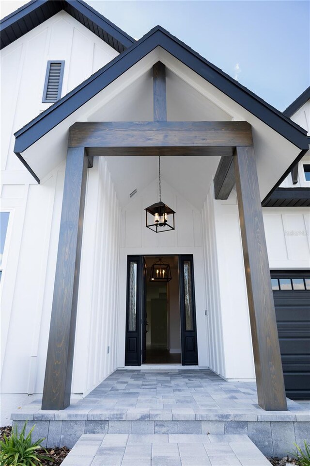 840 SW 144th Dr, Newberry, FL 32669 - view of exterior entry featuring board and batten siding