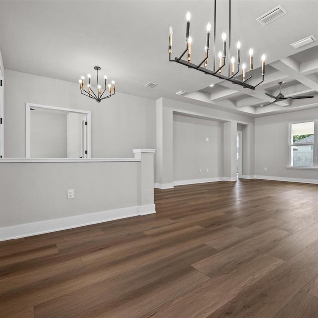 unfurnished dining area featuring beam ceiling, dark wood-type flooring, ceiling fan with notable chandelier, and coffered ceiling