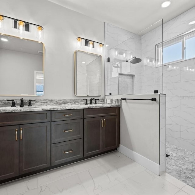 bathroom featuring vanity and tiled shower