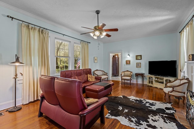 living room with ceiling fan, wood-type flooring, and a textured ceiling