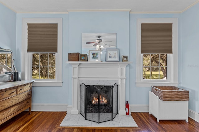 living room with crown molding and dark hardwood / wood-style floors