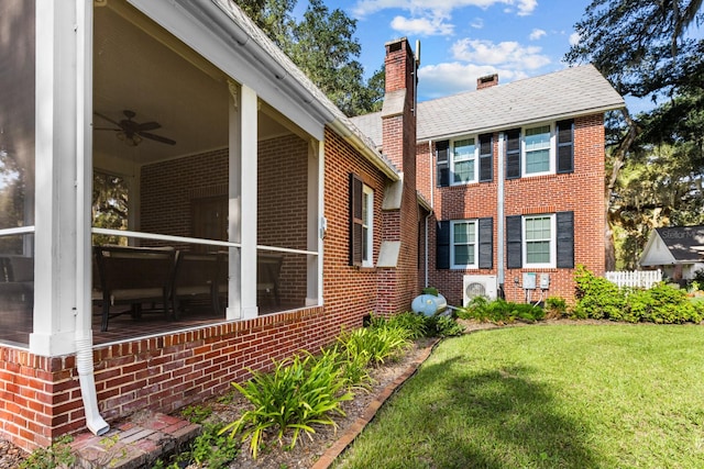 view of property exterior featuring a yard and ceiling fan