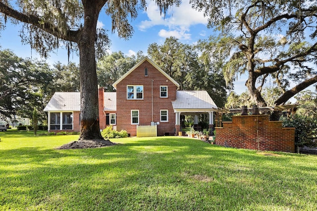 back of house with a yard