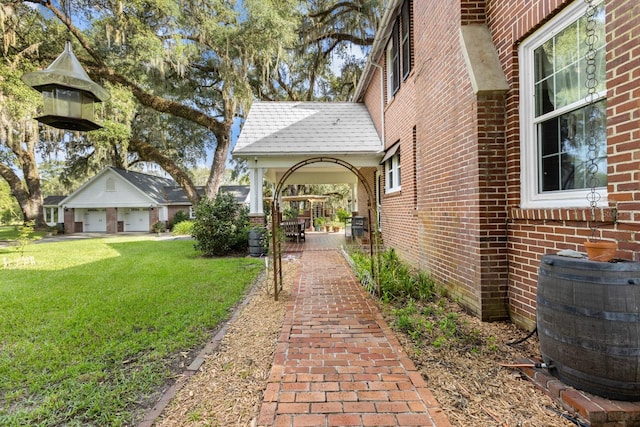 view of property's community with a yard and a garage