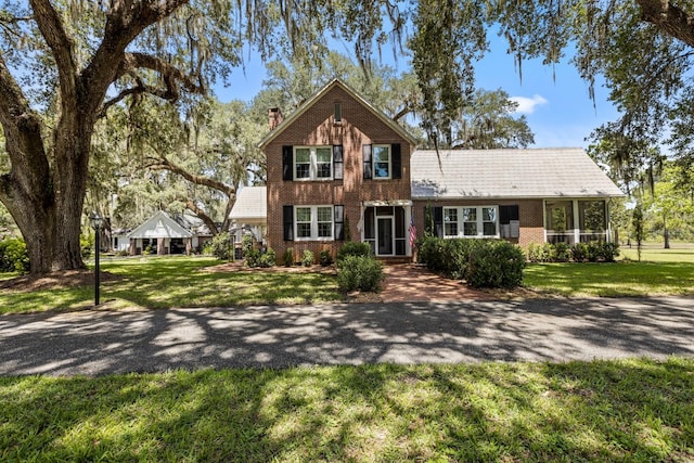 view of front of property with a gazebo and a front yard