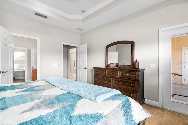 carpeted bedroom featuring ensuite bathroom and crown molding