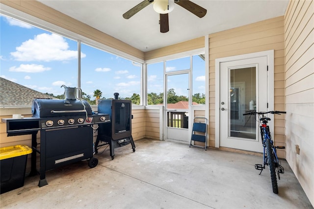 sunroom featuring plenty of natural light and ceiling fan