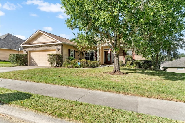 view of front of home with a front yard and a garage