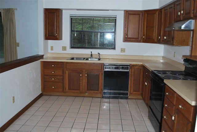 kitchen featuring black appliances, light tile patterned flooring, and sink