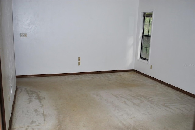 empty room with light colored carpet