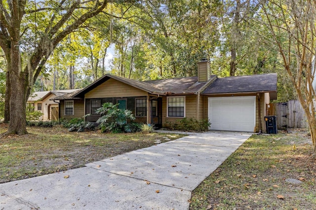 ranch-style home featuring a garage