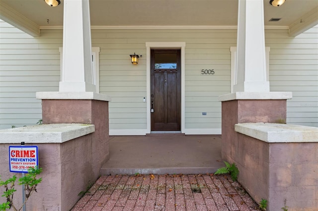 property entrance with covered porch