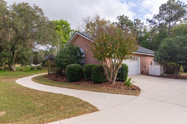 view of home's exterior with a garage and a yard