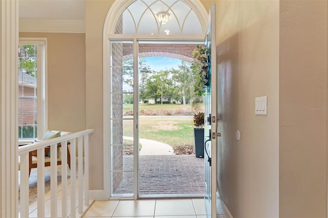 tiled entryway with crown molding