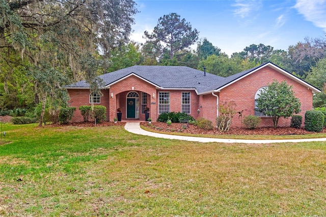 single story home featuring a front yard