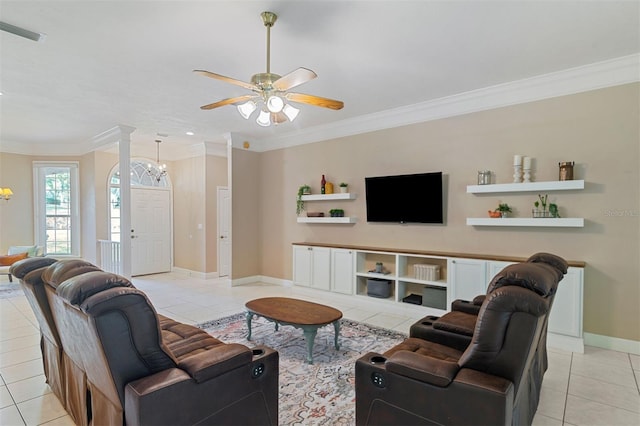 living room featuring ceiling fan with notable chandelier, light tile patterned flooring, and crown molding