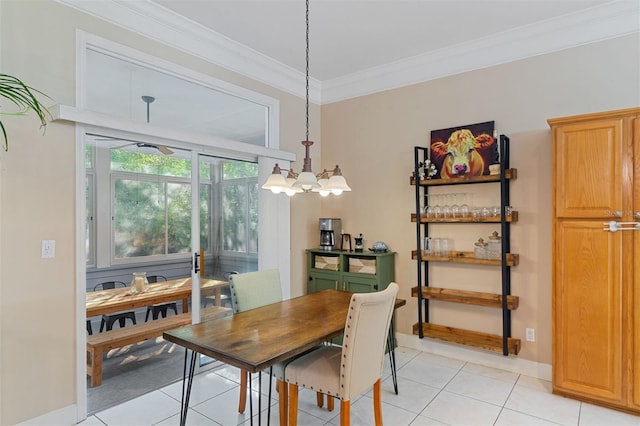 dining area featuring ceiling fan with notable chandelier, light tile patterned floors, and crown molding