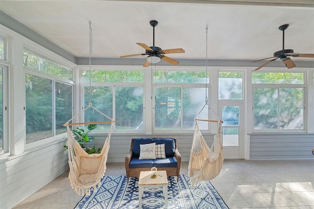 sunroom / solarium with ceiling fan