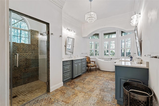 bathroom with vanity, independent shower and bath, ornamental molding, and a chandelier