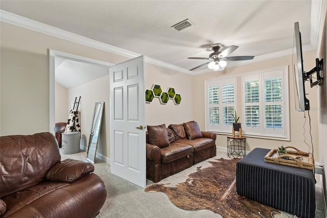 carpeted living room featuring ornamental molding and ceiling fan