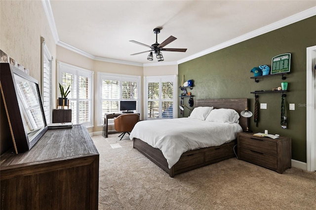 carpeted bedroom featuring crown molding and ceiling fan