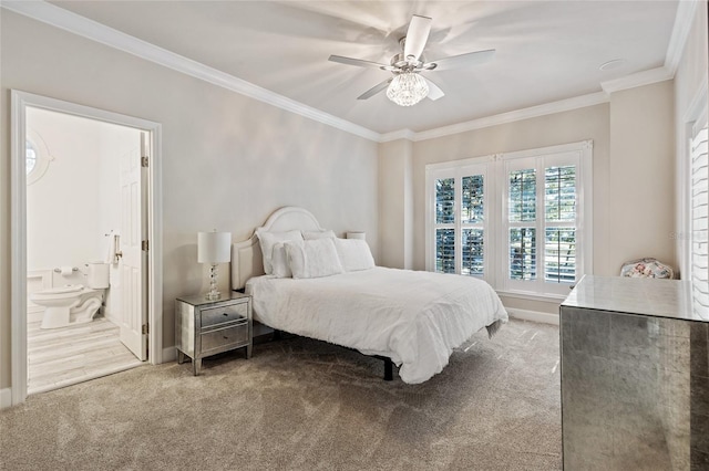 bedroom featuring connected bathroom, ceiling fan, crown molding, and carpet flooring