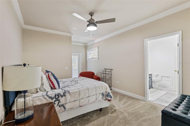 bedroom with crown molding, light carpet, ensuite bathroom, and ceiling fan