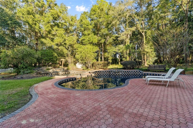 view of property's community with a patio