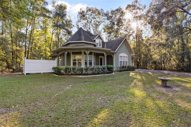 view of front facade with a front yard and a porch