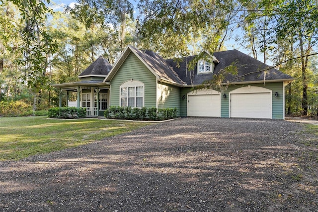 view of front of property featuring a garage and a front lawn