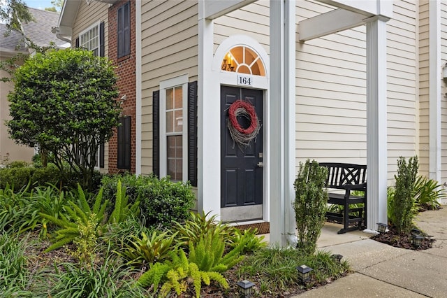 10000 SW 52nd Ave Unit 164, Gainesville, FL 32608 - doorway to property featuring brick siding