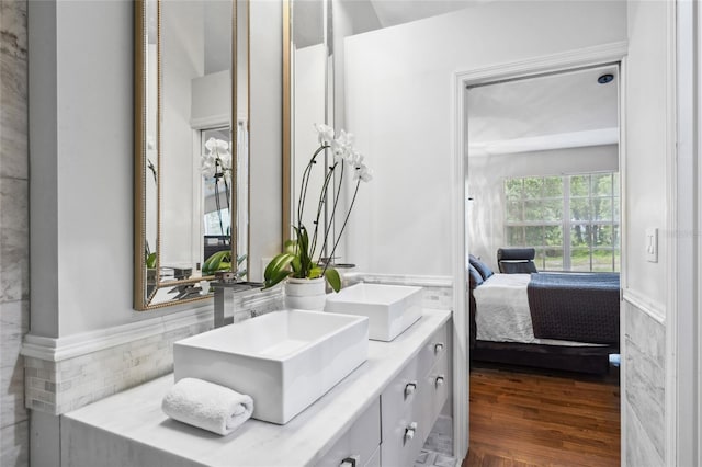 10000 SW 52nd Ave Unit 164, Gainesville, FL 32608 - ensuite bathroom with double vanity and wood finished floors